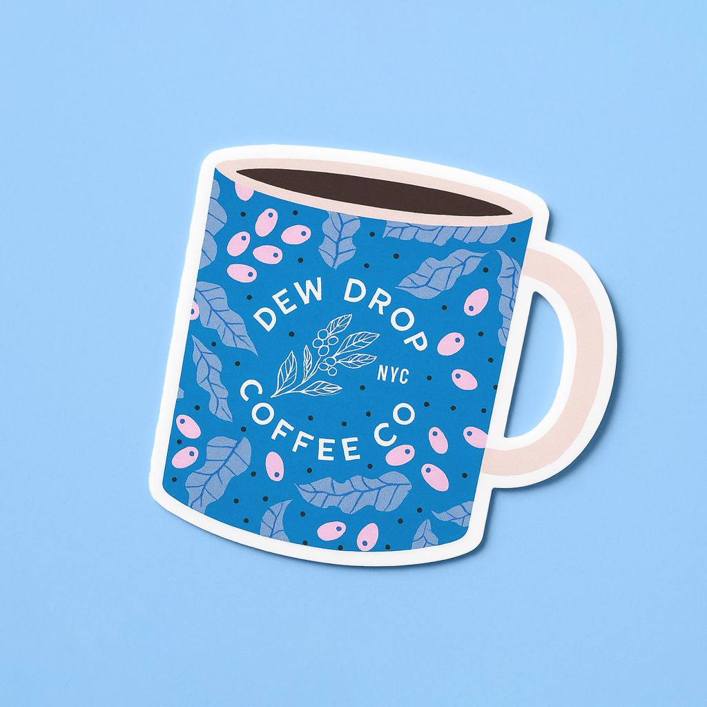 Die-cut coffee mug sticker with a decorative illustrated design on a blue background.